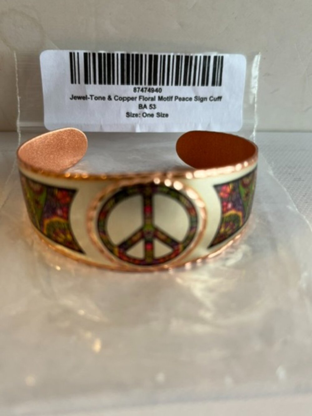 Copper Arts peace sign cuff bracelet.